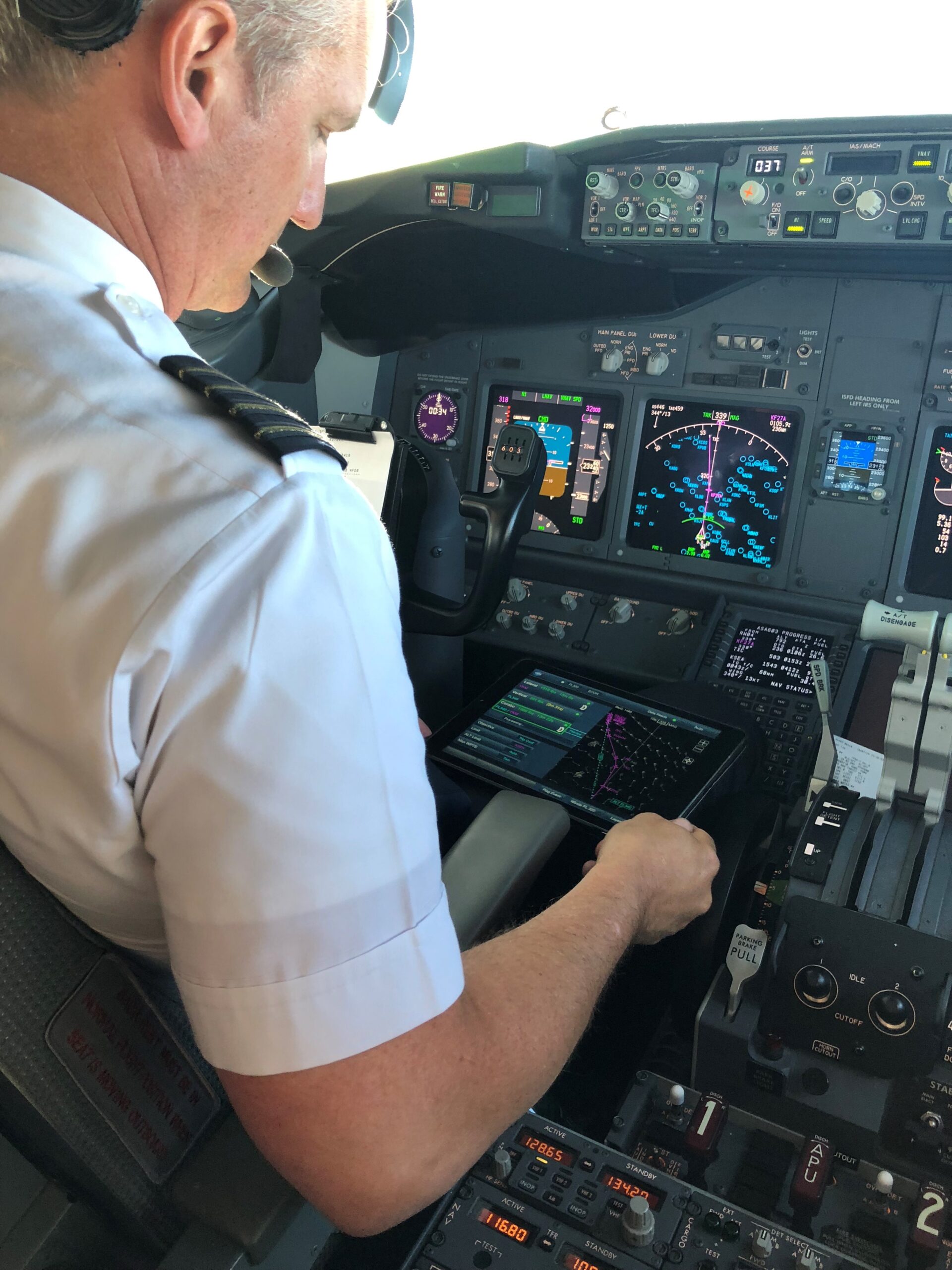 Alaska Airline pilot looking at Traffic Aware Planner (TAP)